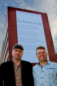 Installation of the “photocatalytic poem”, In Praise of Air, in Sheffield. Present are Simon Armitage (right), and Prof. Tony Ryan (left). Photo from www.sheffield.ac.uk. 