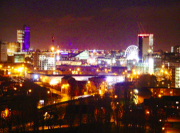 Figure 3. Skyglow in Manchester. This light is scattering off the atmosphere and falling back to the ground. As a result, the sky looks bright orange. Image taken from https://commons.wikimedia.org/ 